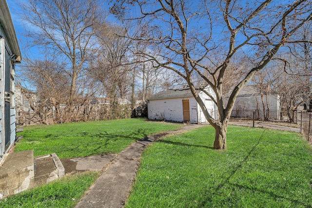 view of yard with an outbuilding and fence