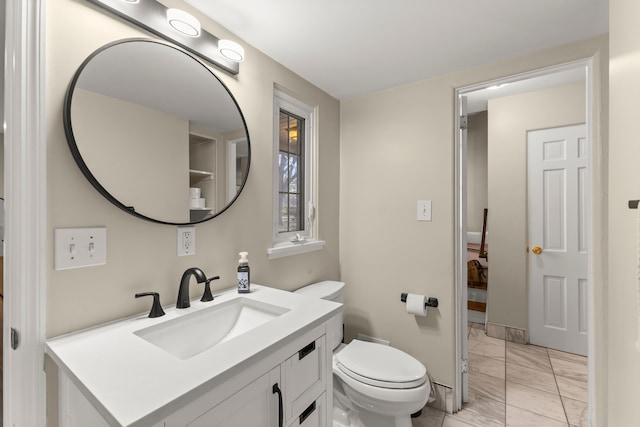 bathroom featuring marble finish floor, vanity, and toilet