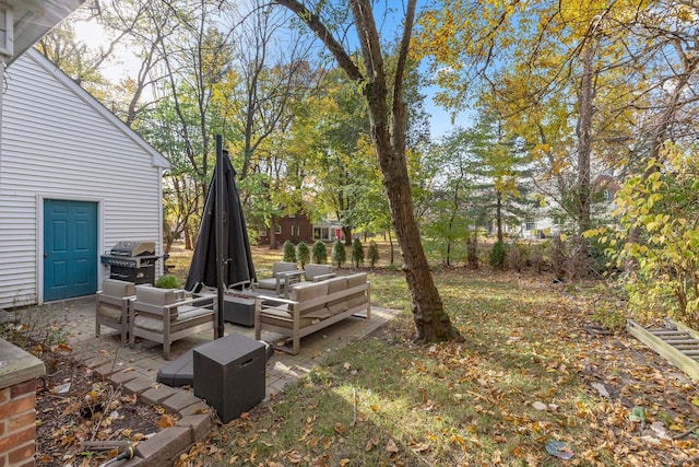 view of yard with outdoor lounge area and a patio