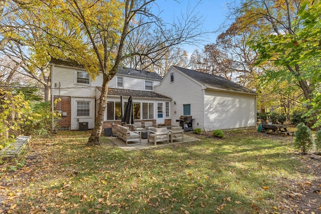 back of house with a patio, a lawn, outdoor lounge area, and central air condition unit