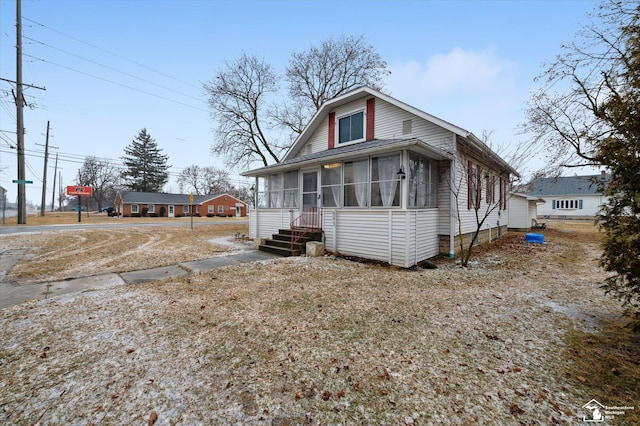 view of front of property with a sunroom