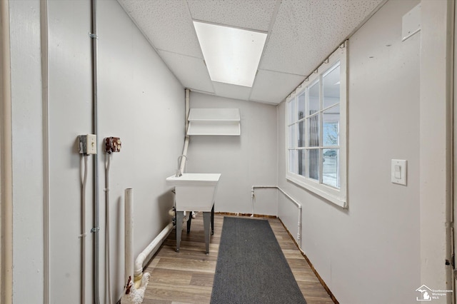 interior space featuring wood finished floors and baseboards