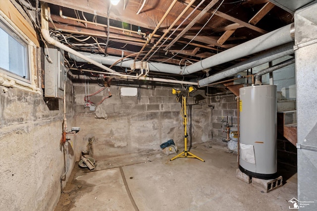 unfinished basement featuring water heater