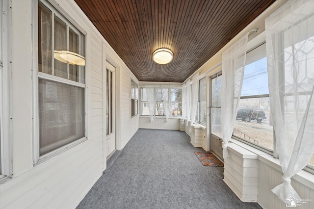 sunroom featuring wood ceiling