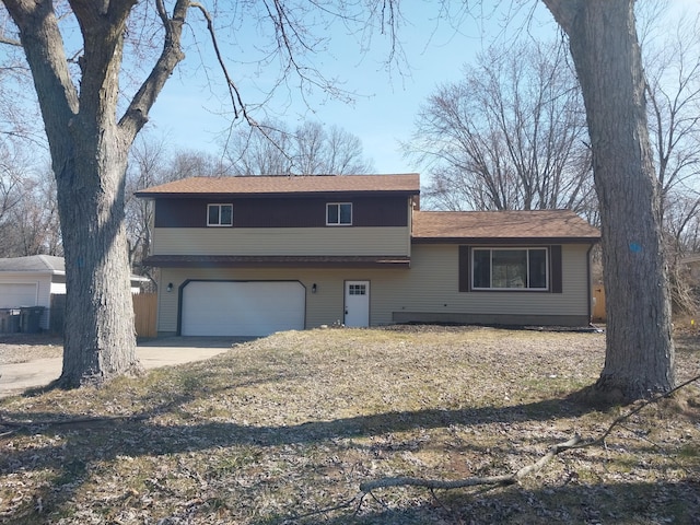 3548 Reginald Dr, Muskegon, MI 49444 - split level home featuring a garage and concrete driveway