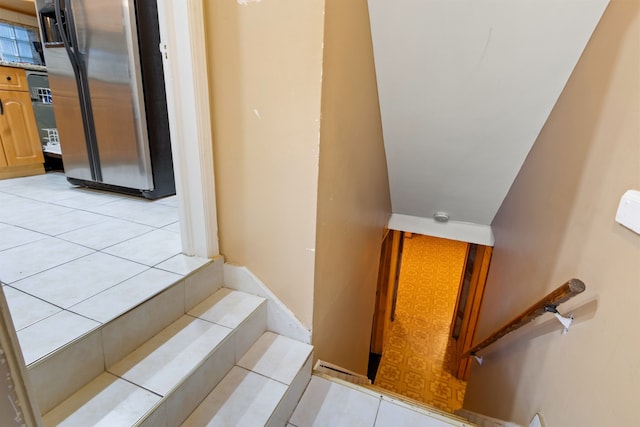 stairs with tile patterned floors