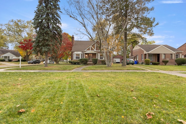 view of front of house with a chimney and a front yard