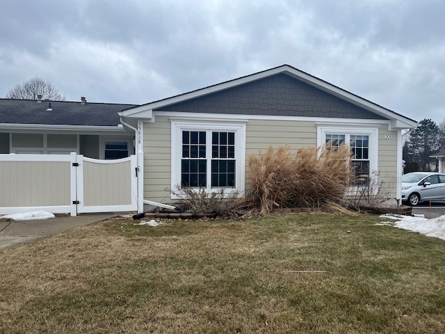 view of property exterior featuring a lawn