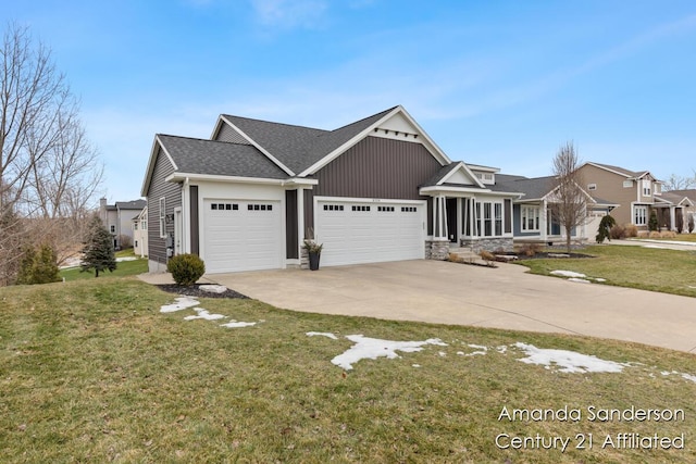 view of front of property with a garage, concrete driveway, a shingled roof, and a front lawn