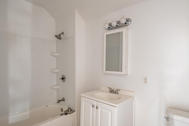 bathroom featuring shower / washtub combination, toilet, and vanity