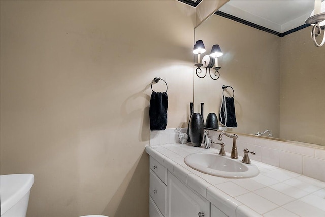 bathroom featuring vanity and toilet