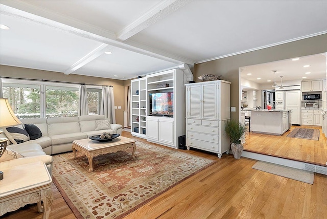 living room featuring light wood-style flooring, crown molding, beam ceiling, and recessed lighting