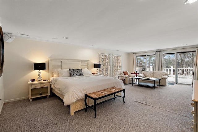 bedroom featuring access to outside, carpet floors, visible vents, and baseboards