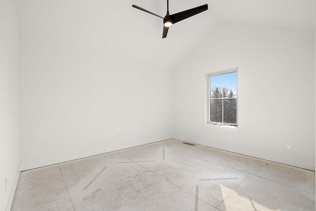 empty room featuring lofted ceiling, visible vents, and a ceiling fan