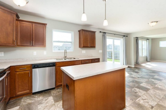 kitchen featuring a kitchen island, a sink, stainless steel dishwasher, brown cabinets, and decorative light fixtures