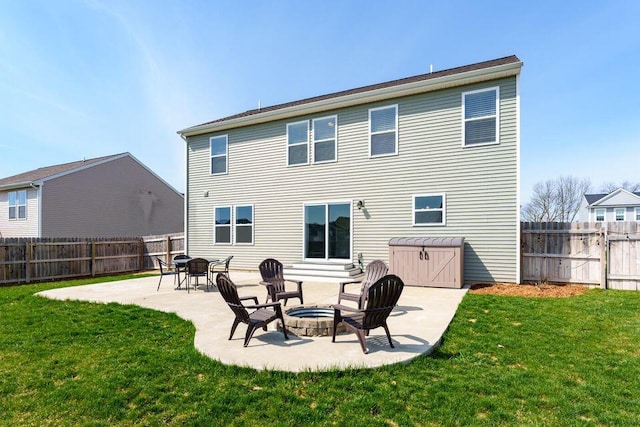 back of house featuring a yard, a fenced backyard, and a patio