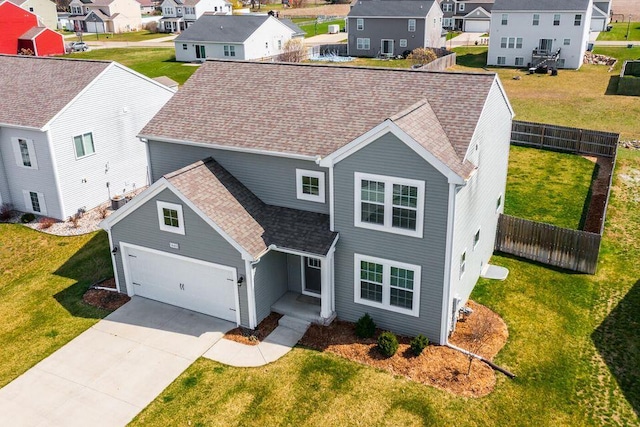 view of front facade featuring roof with shingles, fence, a garage, a residential view, and driveway