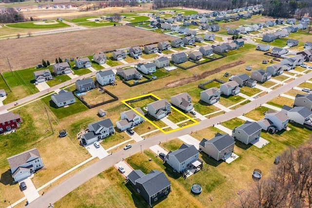 birds eye view of property with a residential view