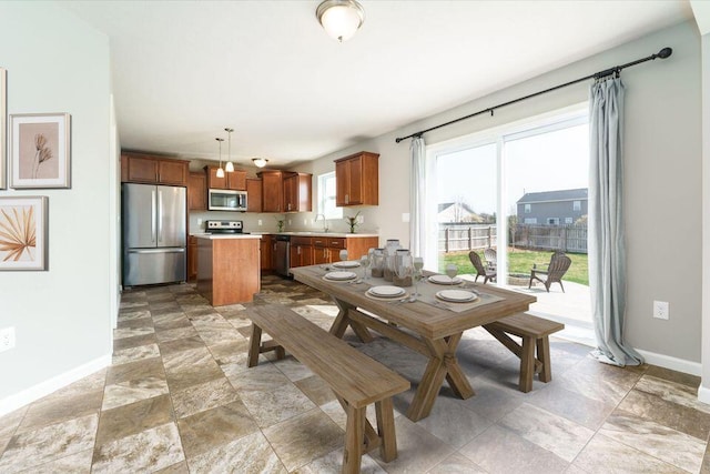 dining room with baseboards