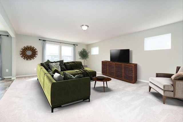 living room featuring light colored carpet and baseboards