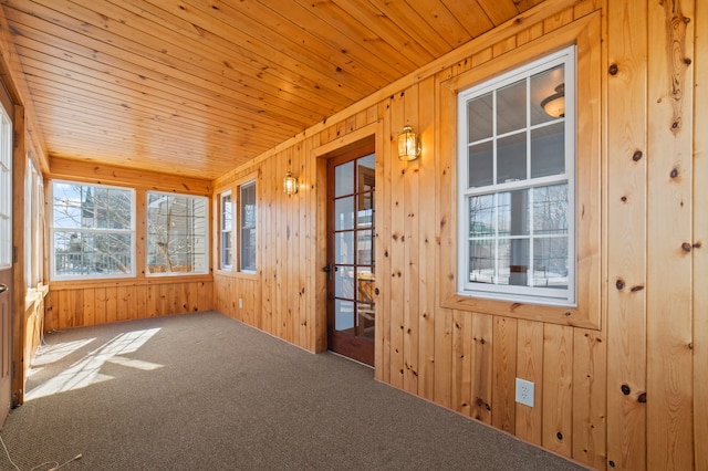 unfurnished sunroom featuring wooden ceiling