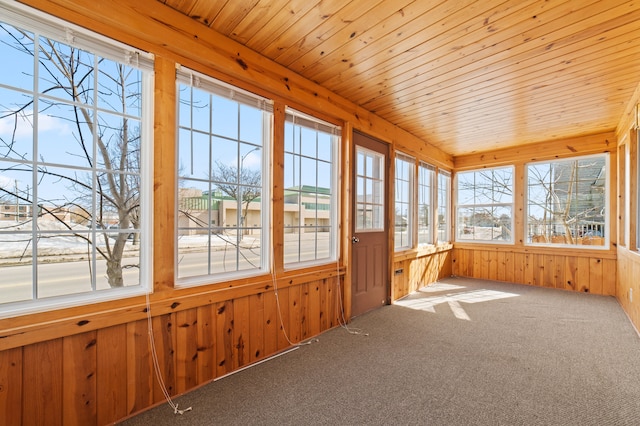 unfurnished sunroom featuring wooden ceiling