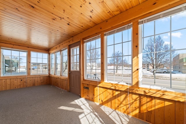 unfurnished sunroom featuring wooden ceiling