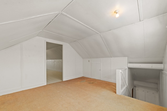 bonus room with carpet and lofted ceiling