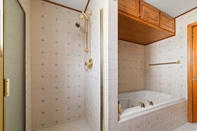 bathroom with a whirlpool tub, a stall shower, ornamental molding, and tile walls