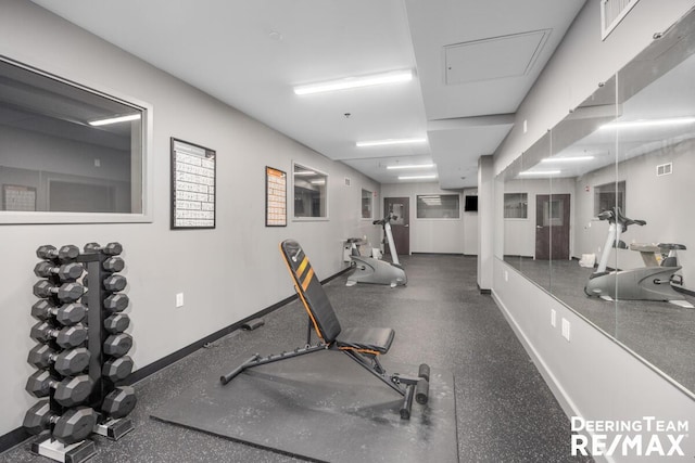 gym featuring visible vents and baseboards