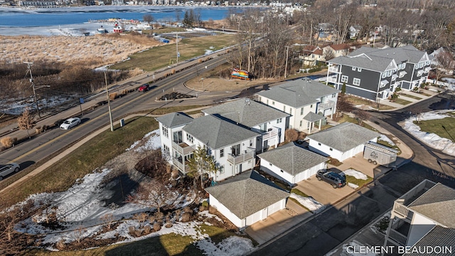 birds eye view of property with a water view and a residential view