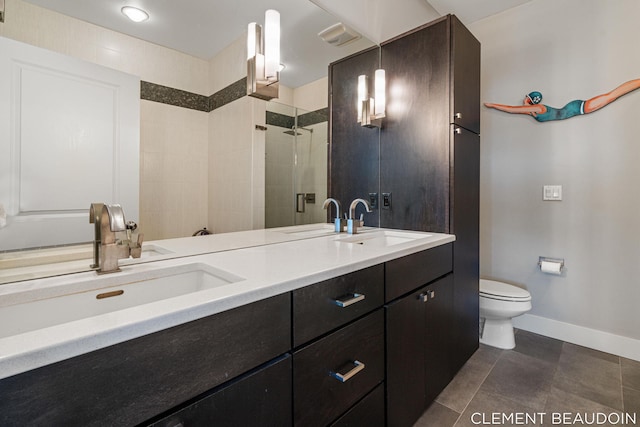 full bathroom with toilet, a stall shower, and a sink