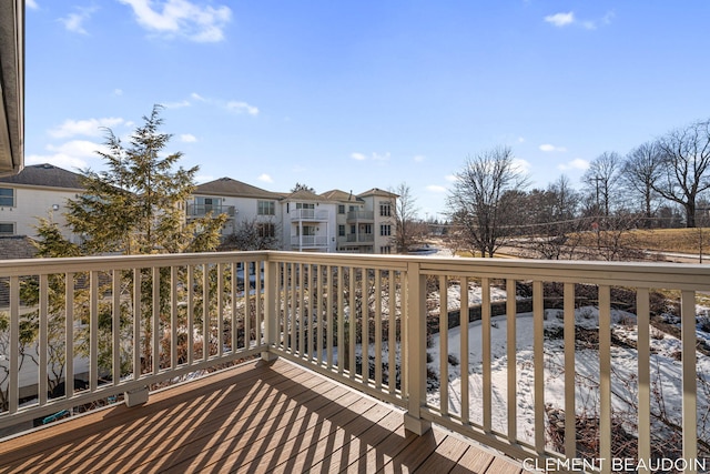 wooden terrace with a residential view