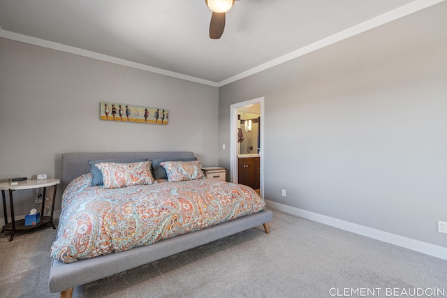 carpeted bedroom featuring ensuite bathroom, ornamental molding, a ceiling fan, and baseboards