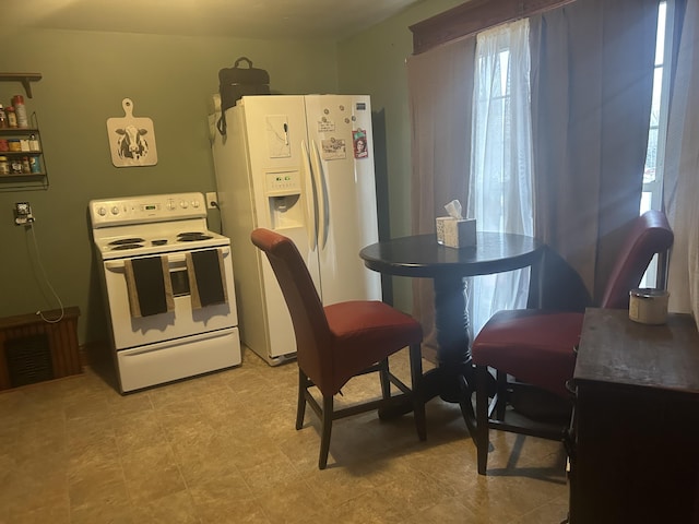 kitchen featuring white appliances and visible vents