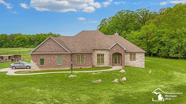 6370 Lewis Ave, Ida, MI 48140 - view of front of house featuring a front lawn, brick siding, and a chimney