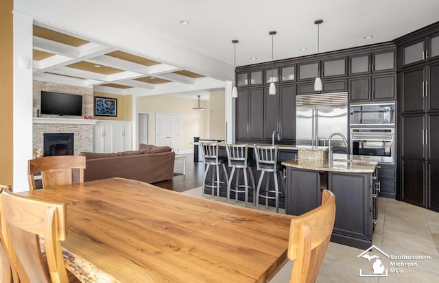 6370 Lewis Ave, Ida, MI 48140 - dining area featuring beam ceiling, coffered ceiling, and a large fireplace