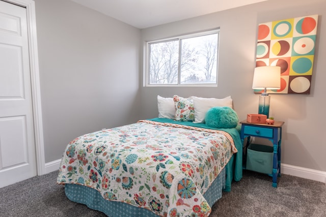 carpeted bedroom with baseboards