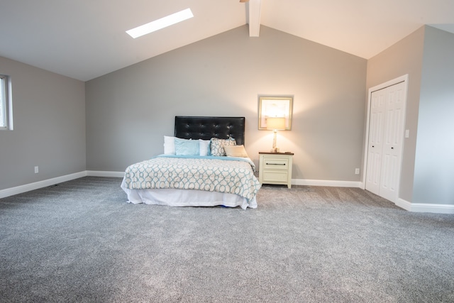 carpeted bedroom with lofted ceiling with skylight and baseboards