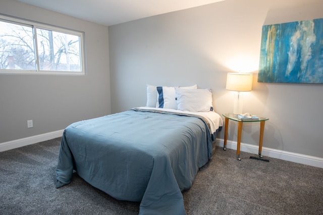 bedroom with carpet flooring and baseboards