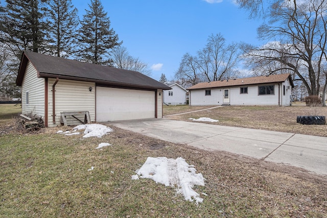 single story home featuring a garage and a front lawn