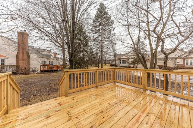 wooden terrace with a residential view