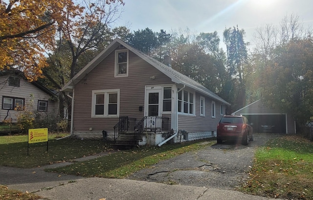 bungalow-style home featuring driveway