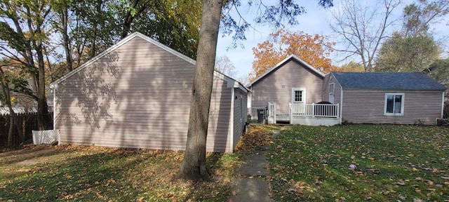 view of property exterior featuring a lawn