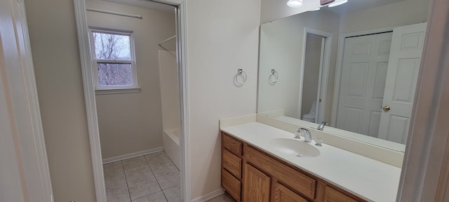 full bath with baseboards, toilet, shower / tub combination, tile patterned flooring, and vanity