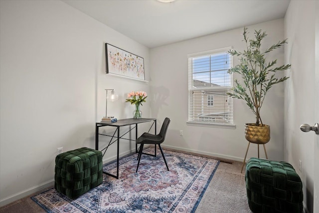 office area featuring carpet floors and baseboards