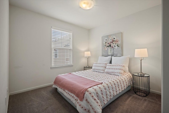 bedroom featuring baseboards and carpet flooring