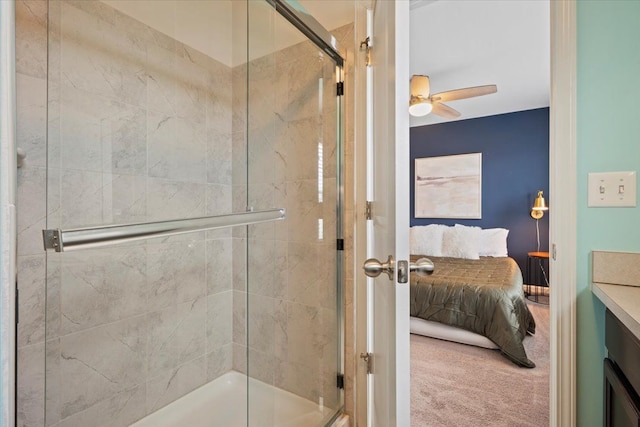 full bathroom featuring a shower stall, vanity, a ceiling fan, and ensuite bathroom