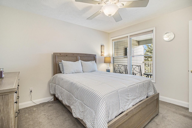 bedroom featuring a textured ceiling, baseboards, and carpet flooring