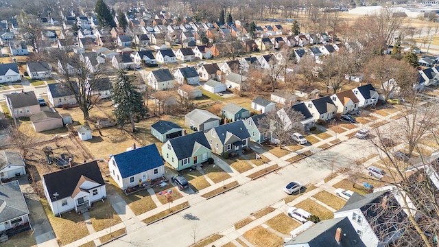 birds eye view of property with a residential view